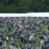 A photo of Coventry Godiva Music Festival uses Kingsmead clearspan and pole marquees for its infrastructure by Kingsmead Marquees