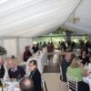 A photo of Clearspan marquee provides the setting for an Aston Flamville wedding for 80 guests by Kingsmead Marquees