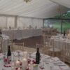 A photo of Clearspan marquee provides the setting for an Aston Flamville wedding for 80 guests by Kingsmead Marquees
